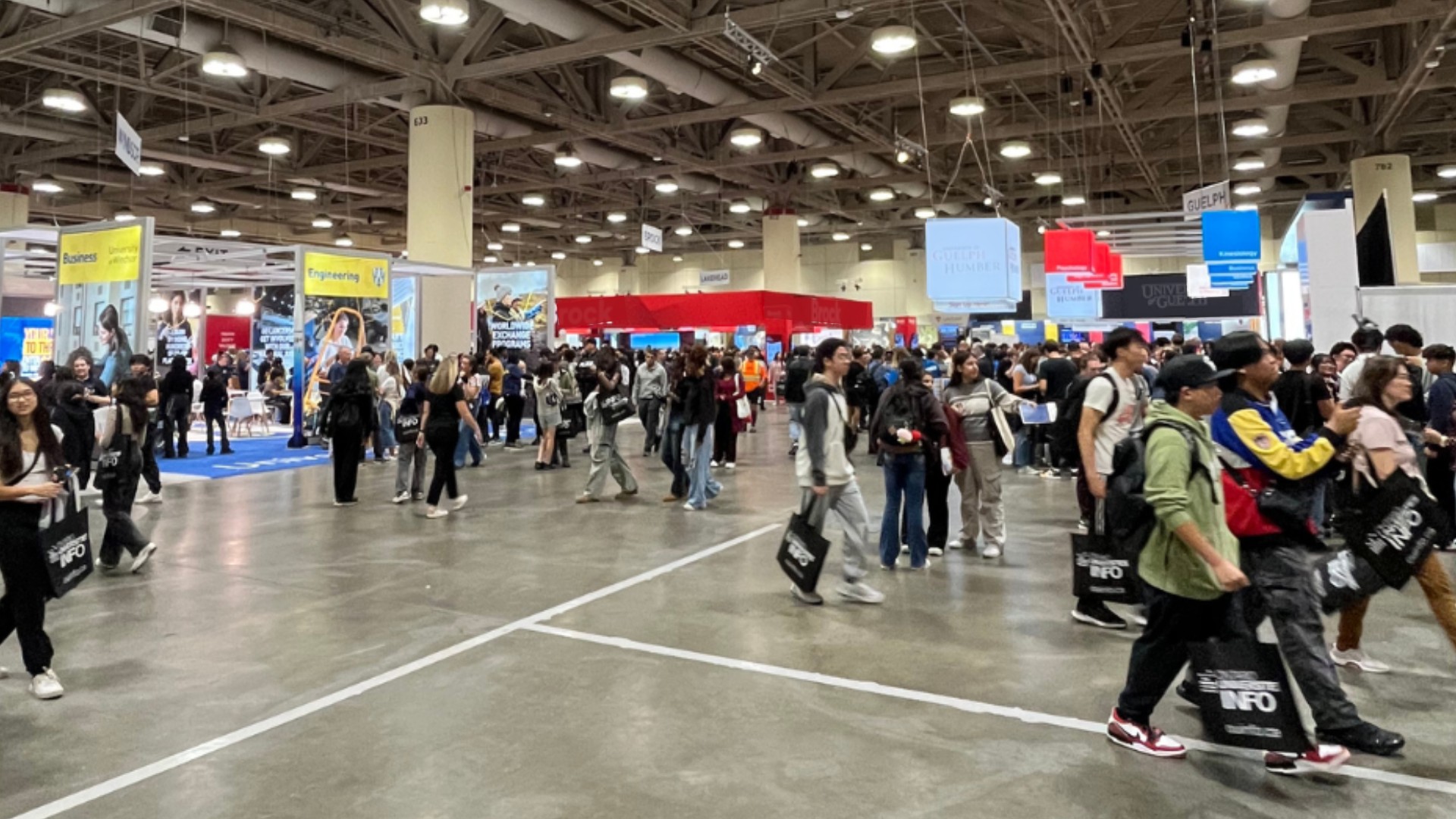 Attendees walking around booths at the OUF